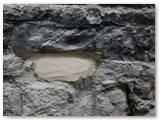 09 Repairs to the stone wall around the half-moon window