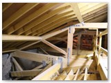 01 Above the vaulted ceiling and below the roof