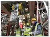 01 The electric hoist is prepared for lifting the fourth section of a pillar on which the capital stone will rest