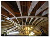 02 Looking through the wooden frame of vaulted ceiling to the roof above