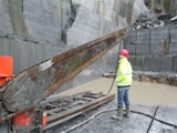02 The large diamond-tipped chain saw which cuts the blue limestone into large blocks