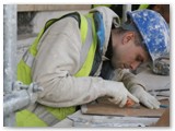 02 The plasterer cuts the mould to shape the intricate plaster work