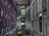 03 A mini-excavator and dumper truck clearing earth at crypt level in the side aisle on the presbytery side