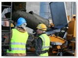 03 The concrete is poured from the cement lorry into the receiver on the pumping lorry