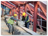 03 The old coping stone is rolled to where it can be extracted from the Cathedral by the tower crane