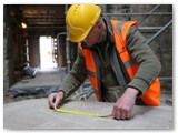04 Measuring tape out near the main entrance door where the new baptismal font is being placed