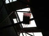 05 The skip is drawn up through the sliding door now installed on the College side of the temporary roof