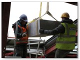 05 The stone is carefully lowered onto rollers
