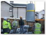 06 A recently delivered section of pillar is hoisted inside by the tower crane