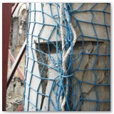 07 Pillar clearly showing the damage done to the solid limestone sections with netting to prevent falling debris