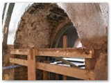 08 A stained-glass window arch awaiting further plastering