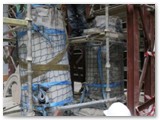 08 The piece of pillar is lowered onto the right position on the trolley
