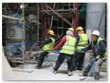 09 Four workers haul the pillar away