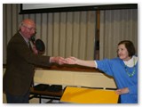10 Pat Chapman is handed the ticket to announce the name of the first prize winner