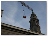 11 a skip in mid-journey above the temporary roof
