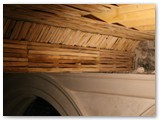 11 The roof timber laths built on the wooden frame meet the plaster and the side wall