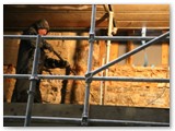 11 The west wall being power-washed in preparation for plastering and installation of pilasters
