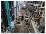 13 Twelve pillars are being constructed to support the concrete subfloor that will be poured shortly