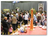 14 Retrieving the baskets of food at the end of the ceremony