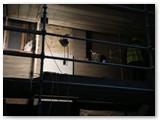 15 A pilaster is built up the side wall between a boarded up stained glass window opening (left) and a statue niche (right)