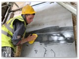 16 The excess mortar is washed off