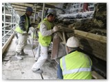 16 The fresh plaster is roughly shaped by a muffle mould made on site