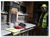 20 A worker examines different cleaning techniques on the Blessed Sacrament altar