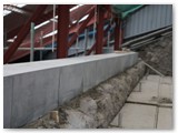 24 A close up of the wall completely topped with coping stones