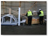 28 Half-moon window frames are prepared to be lifted to the roof