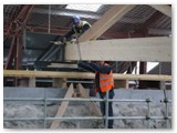 33 The roof truss is pushed at either side along the timber roadway