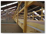 49 A wooden access walkway is then constructed along the centre of the nave through the roof trusses