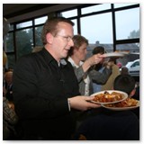 30 Fr Brendan O'Sullivan and Colette Skelly of the Pastoral Council distribute the food at the parish celebration afterwards